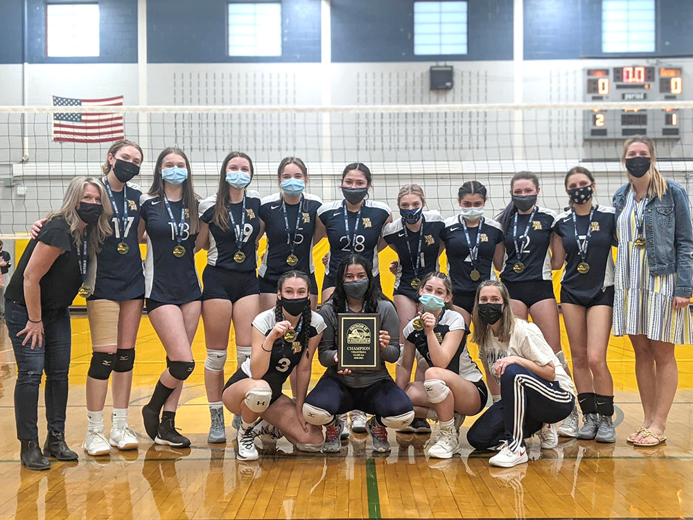 The Pine Bush volleyball team poses with the Section 9 Class AA championship plaque on April 20, after winning their 18th title with a 3-1 win over Monroe-Woodbury.